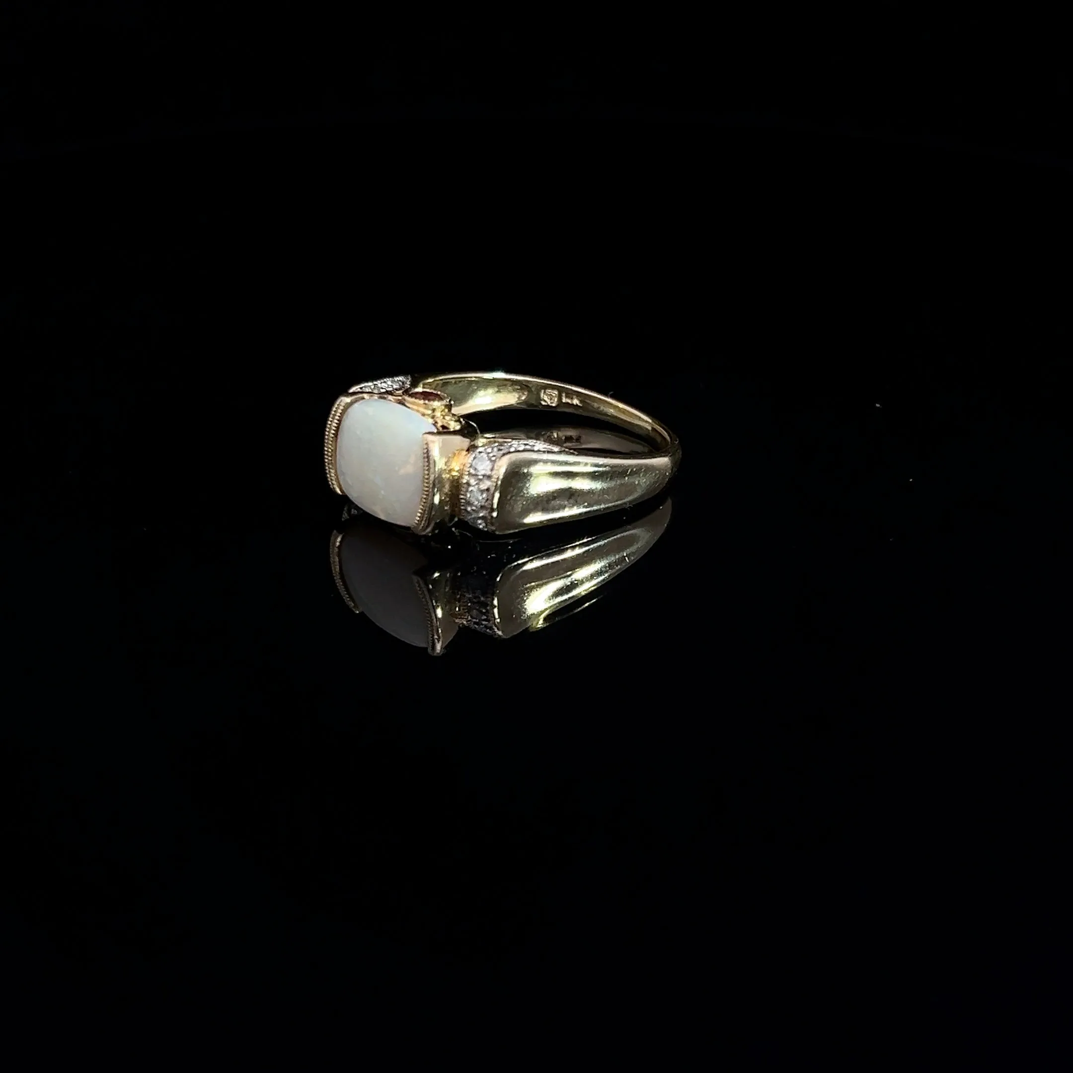 14k Yellow Gold 2.00ct Oval Opal/ .12ct Round Diamond and .10ct Round Rhodolite Garnet Ring