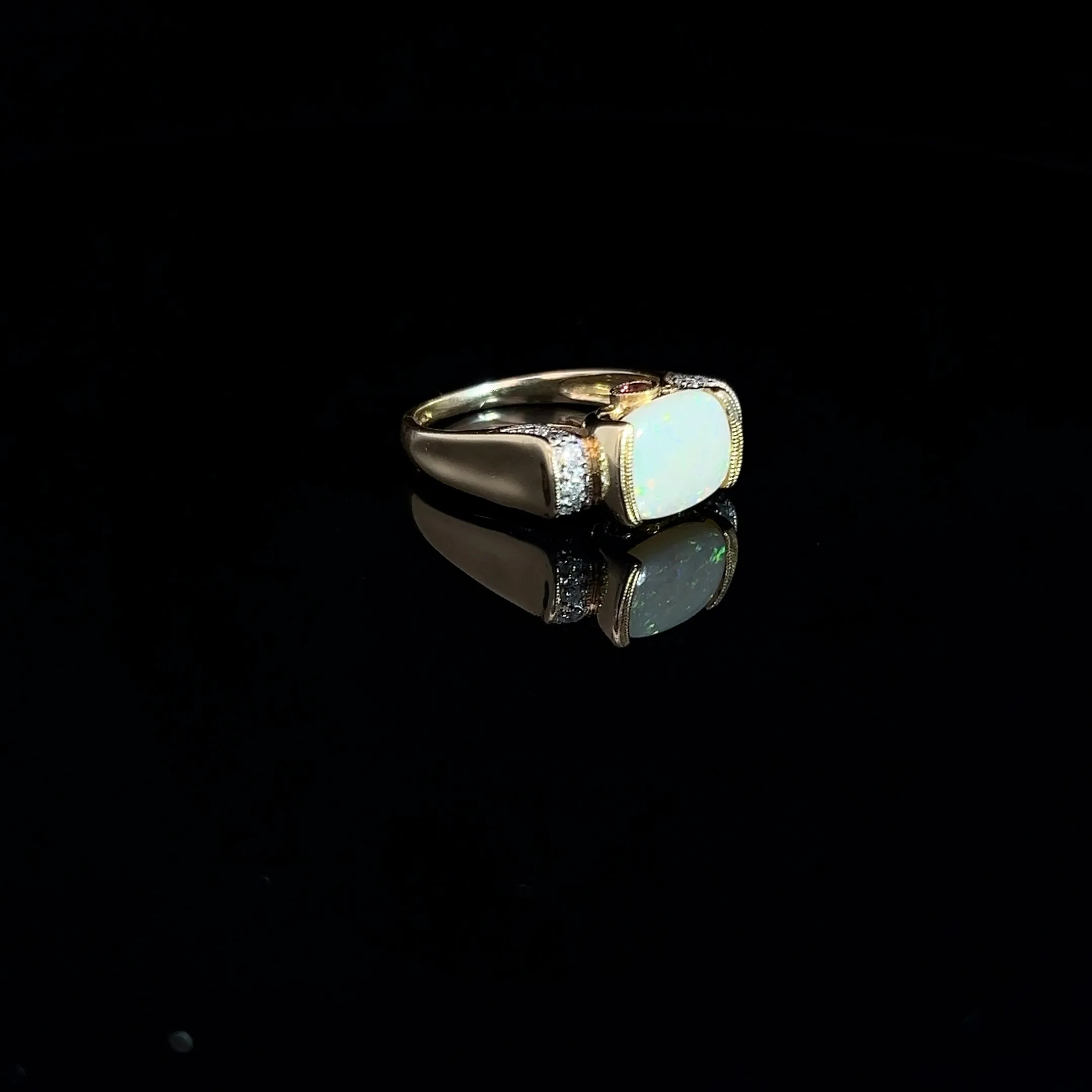 14k Yellow Gold 2.00ct Oval Opal/ .12ct Round Diamond and .10ct Round Rhodolite Garnet Ring