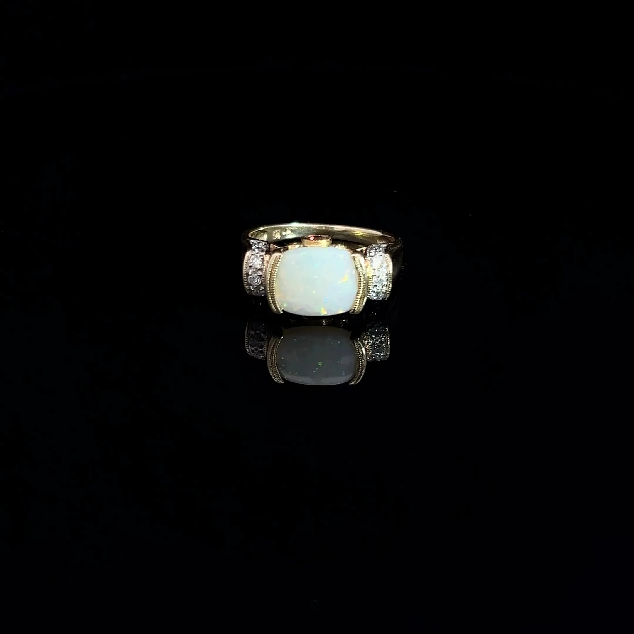 14k Yellow Gold 2.00ct Oval Opal/ .12ct Round Diamond and .10ct Round Rhodolite Garnet Ring
