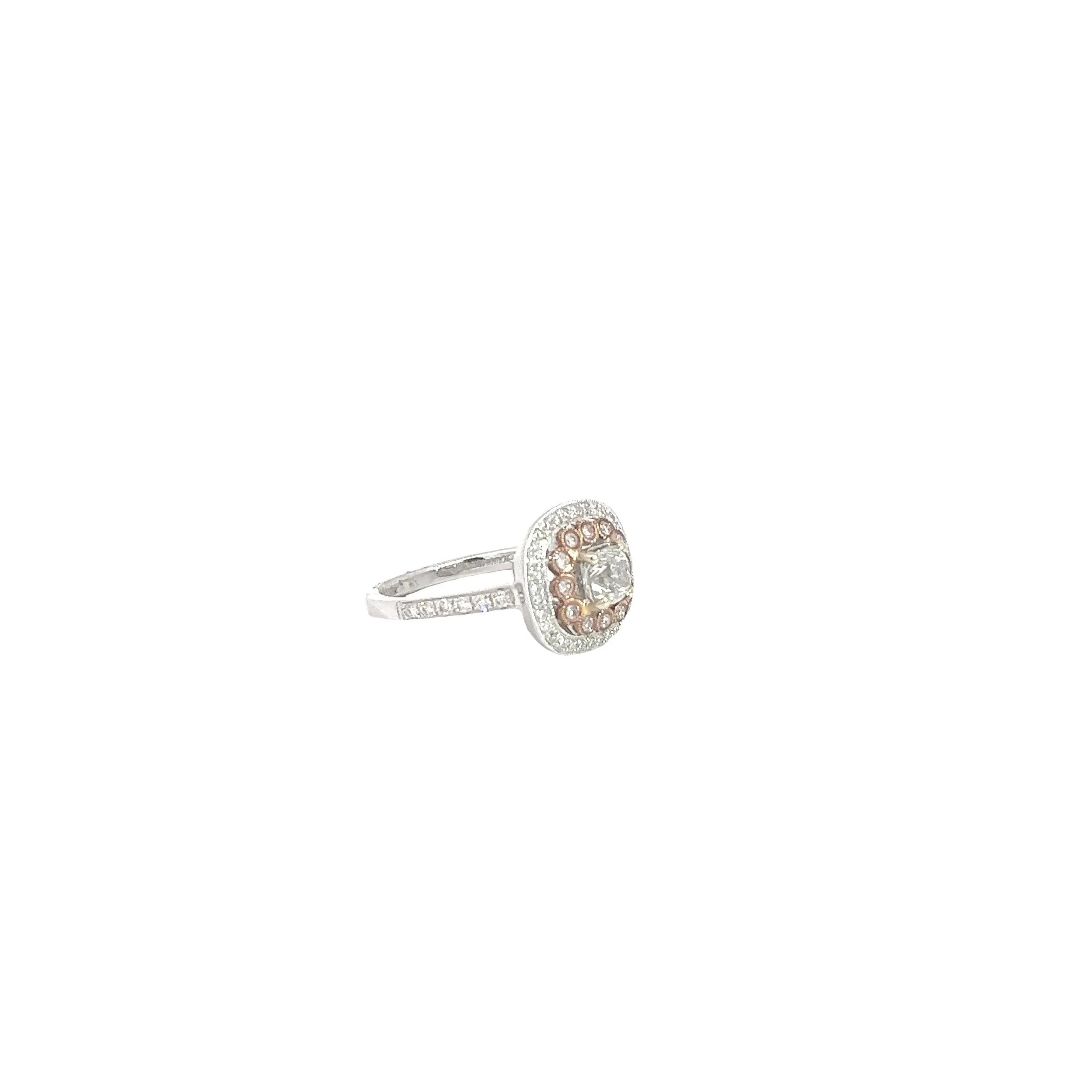 18k White and Rose gold.70ct G SI1 Radiant Diamond and surround by .42ct G SI1 Round Diamond around the Halo and along the band total weight Engagement Ring Size 6 1/2
