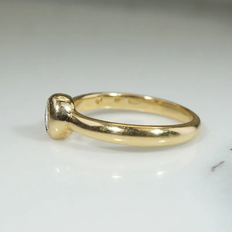 Oval Diamond Bezel Set in Buttery Gold Solitaire Ring