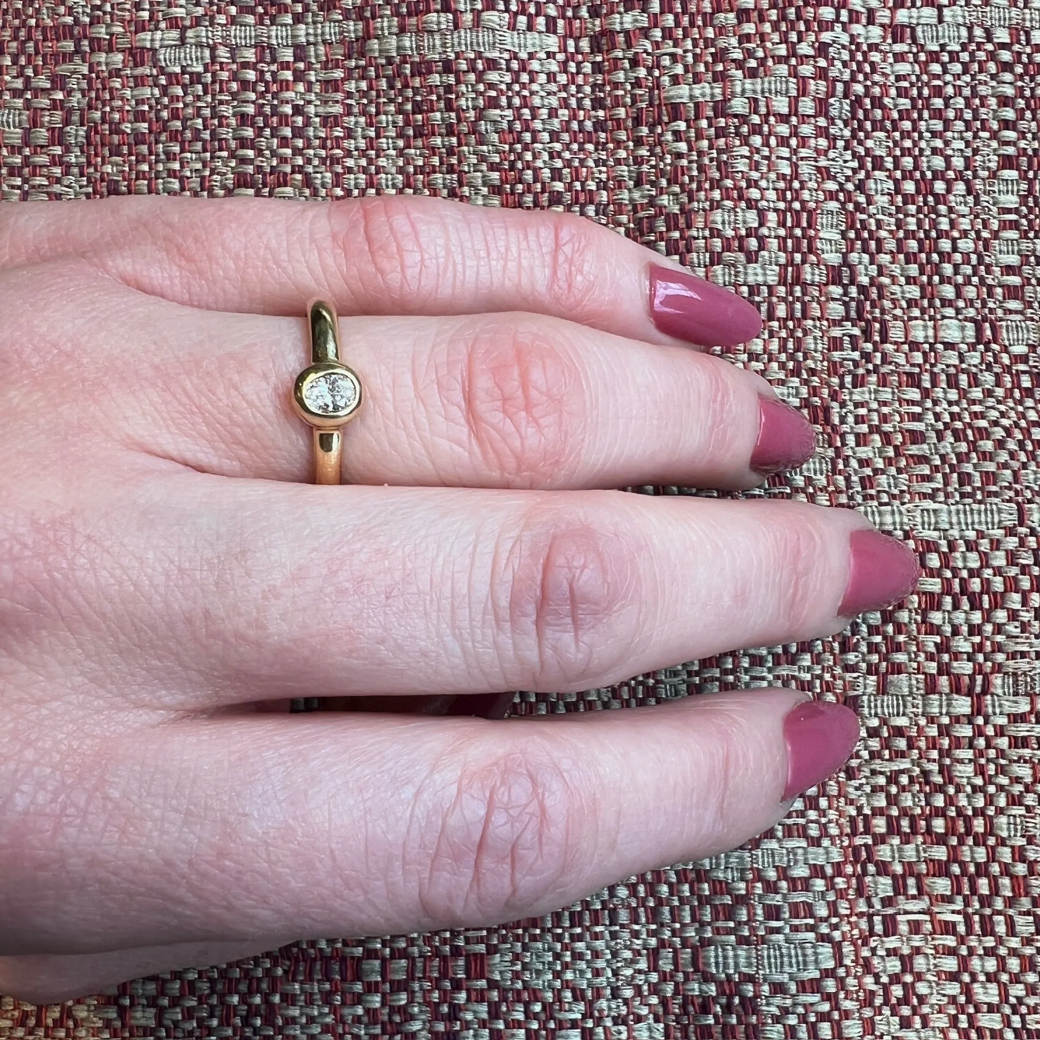 Oval Diamond Bezel Set in Buttery Gold Solitaire Ring