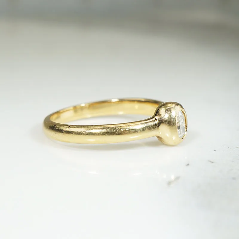 Oval Diamond Bezel Set in Buttery Gold Solitaire Ring